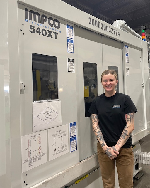 Ashley standing next to 540XT Ashley standing next to 540XT